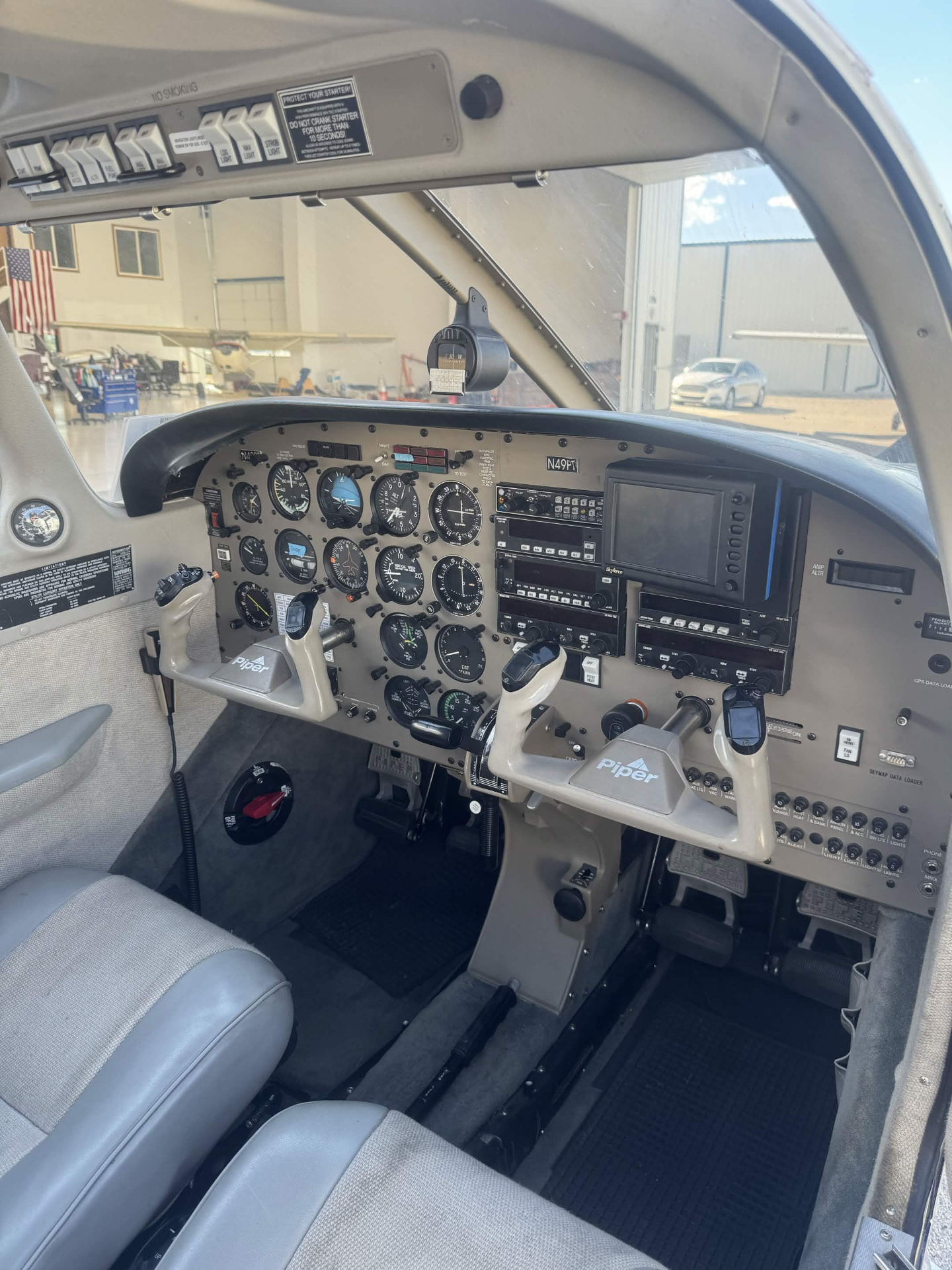 Piper Archer cockpit instrument panel and dual flight controls used for flight training